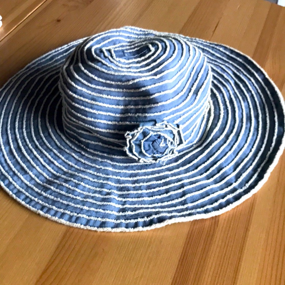 Blue and white striped summer hat with flower